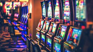 binjai mobile app interface showing live dealer tables and account menu